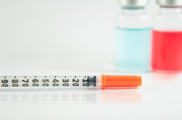 Disposable syringe and injection vial background