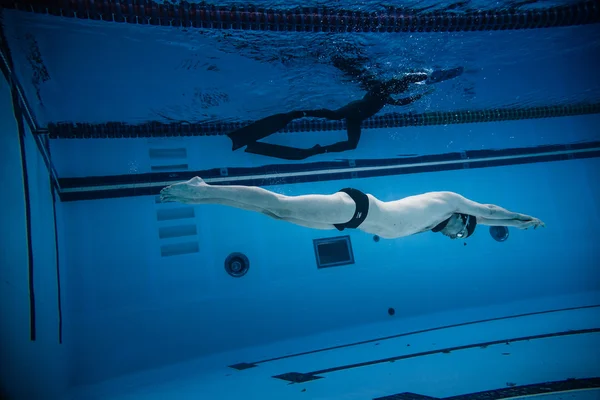 Dynamic no Fins Freediver during Performance from Underwater