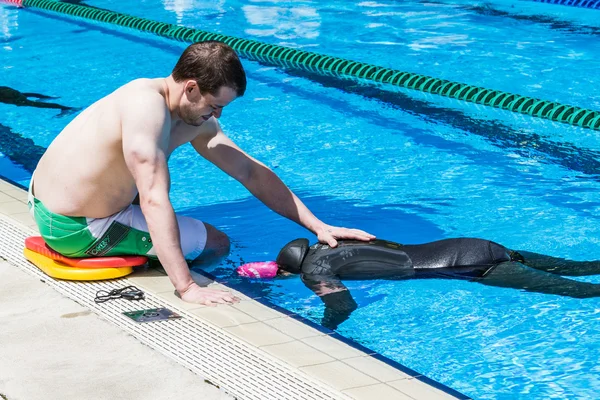 Freediver doing Static Performance with Coach a Coach Doing the