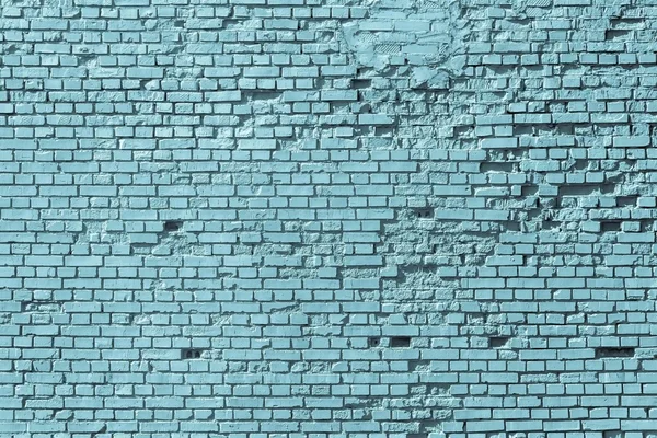 Part of an old blue brick wall