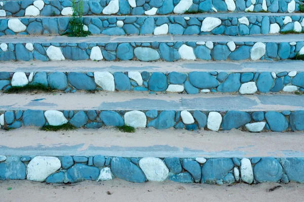 Stone steps with an abstract pattern of bright blue color
