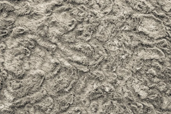 Texture of abstract beige-haired fur fabric