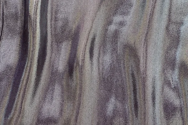 Fabric with iridescent stains of motley color