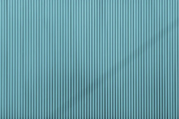 Turquoise color corrugated texture of a surface iron leaf