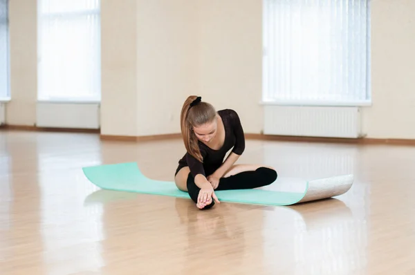 Young girl doing exercises in  dance class
