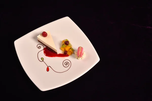 Plated dessert with poached pears in white porcelain plate