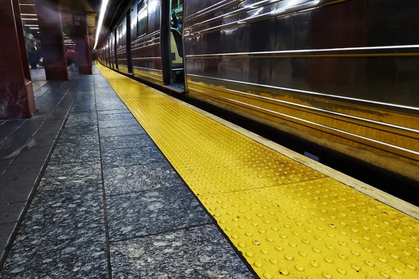 Commuters wait for underground train