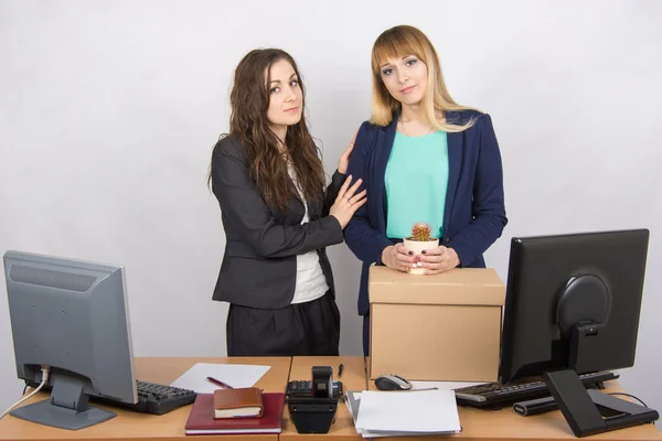 Young office employee who was fired colleague consoles