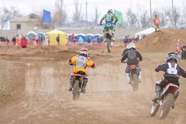 Volgograd, Russia - April 19, 2015: A few riders in pursuit of the leader, at the stage of the Open Championship Motorcycle Cross Country Cup Volgograd Region Governor