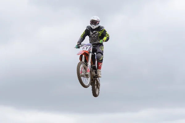 Volgograd, Russia - April 19, 2015: Motorcycle racer in flight, at the stage of the Open Championship Motorcycle Cross Country Cup Volgograd Region Governor