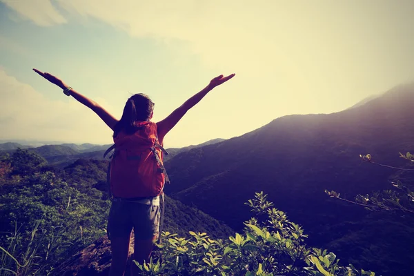 Cheering woman with open arms