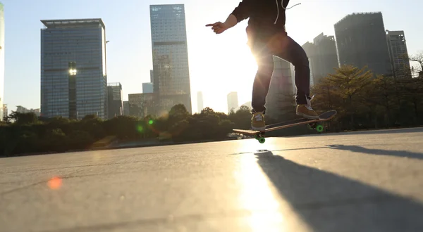 Skateboarding legs at city