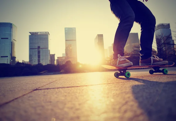 Skateboarding legs at city