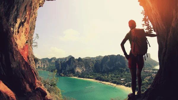 Woman hiker over sunset mountain