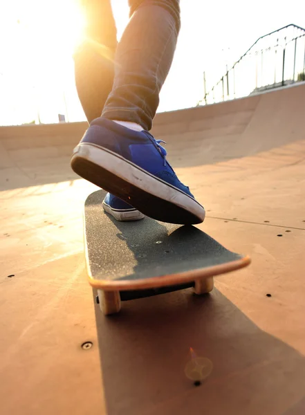 Skateboarding woman legs at skatepark