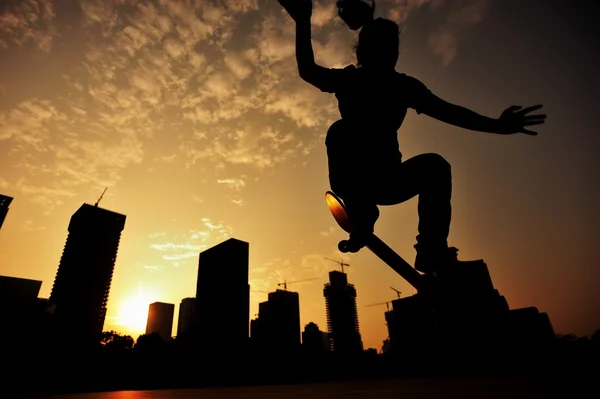 Skateboarder  at sunrise city