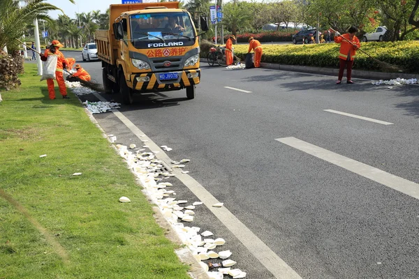 Cleaners cleaning used paper cups