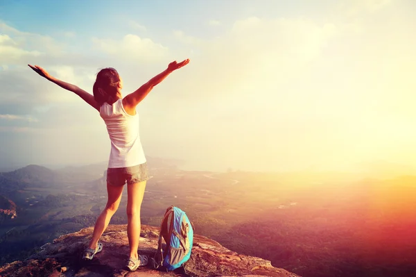 Woman hiker with open arms