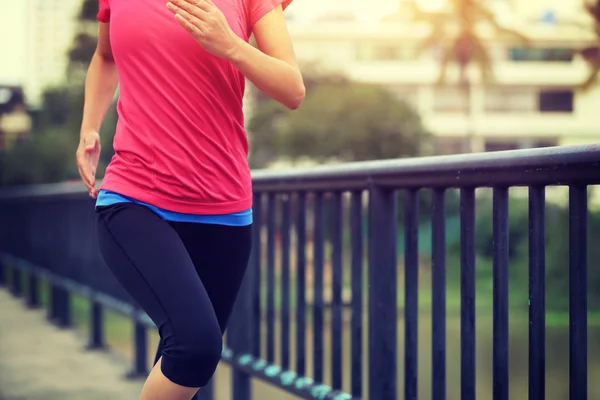 Young fitness woman jogging