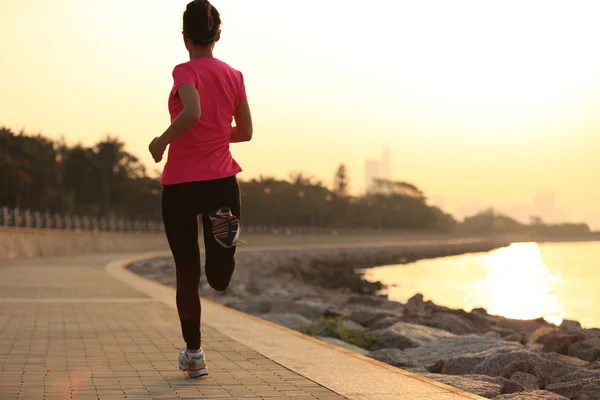 Woman running at seaside