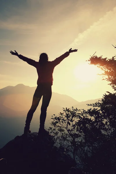 Cheering woman with open arms