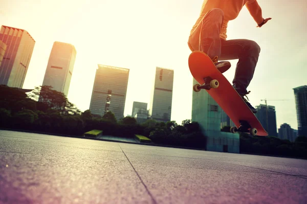 Skateboarder skateboarding over city