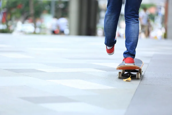 Young skateboarder legs