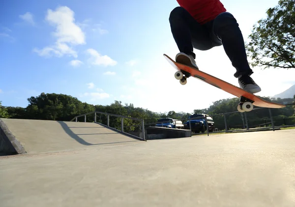 Skateboarder jumping ollie trick