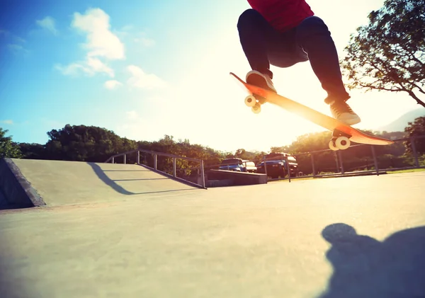 Skateboarder jumping ollie trick