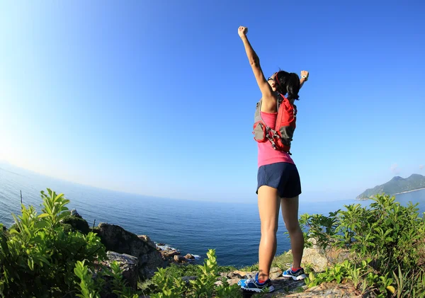 Cheering woman  with open arms