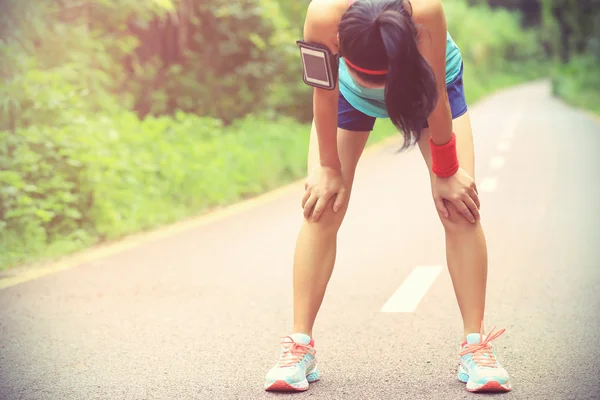 Woman runner taking rest