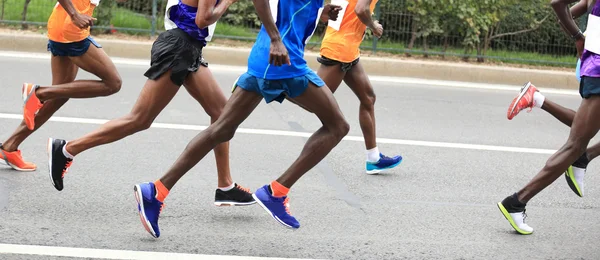 Marathon runners on road