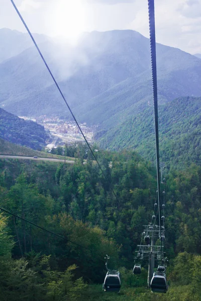 Cable car over the city and mountains