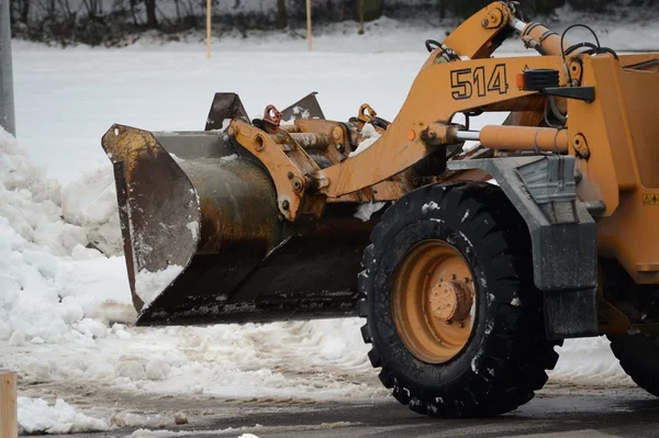 Excavator in snow removal