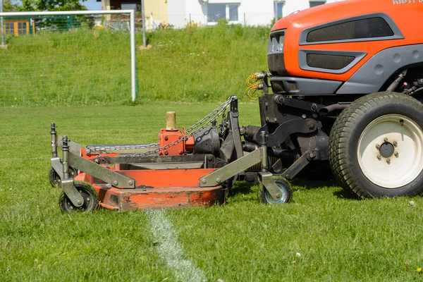 Lawn tractor on sports facility - lawn mowing