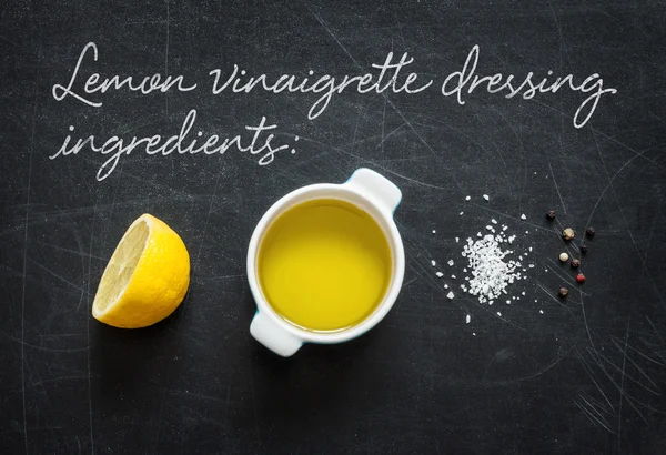 Lemon vinaigrette dressing - recipe ingredients on black from ab