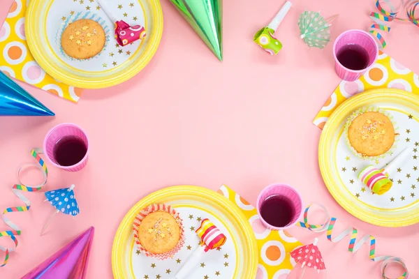 Girl birthday pink table setting with party gadgets