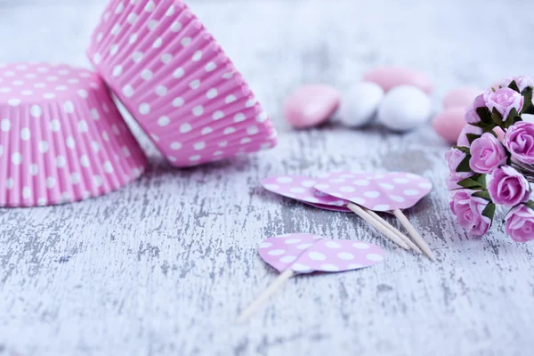 Sugar coated candies, cupcake baking cups