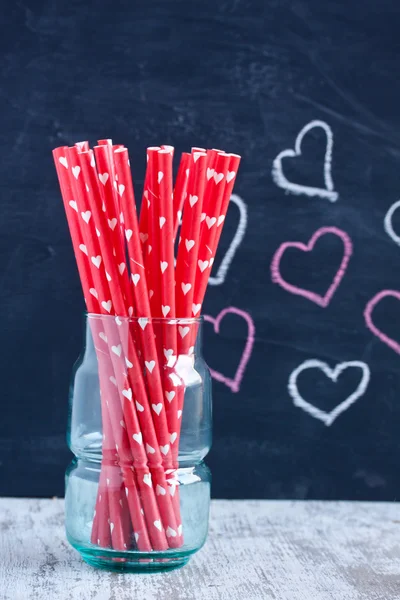 Drinking straws on a blackboard