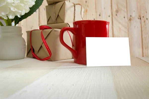 Blanck business card, gift box and red coffee cup