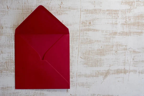 Red envelope, white  wood background