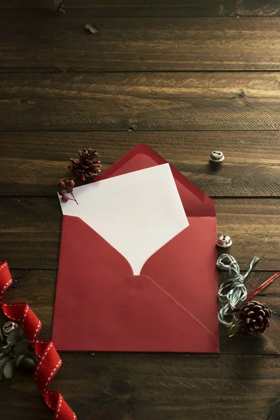 Red envelope, white note and Christmas decoration