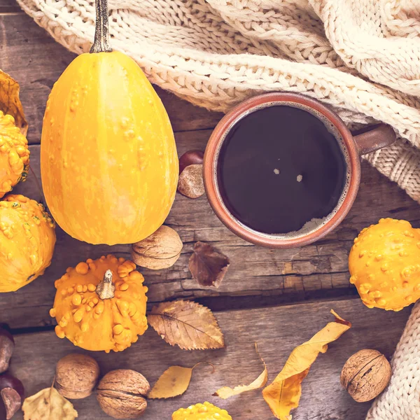 Cup of coffee, pumpkin, autumn leaves