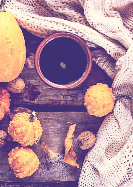 Cup of coffee, pumpkin, autumn leaves