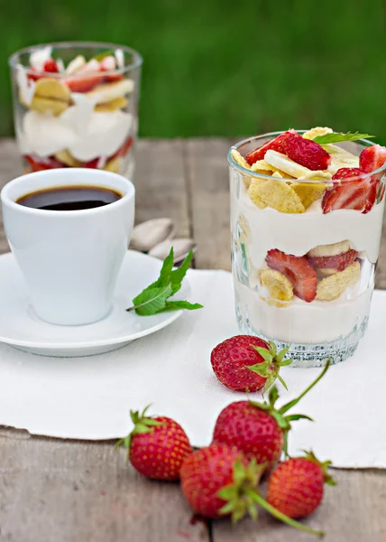 Dessert with strawberries.Cheese, strawberry, banana, cornflakes on the table. Breakfast.