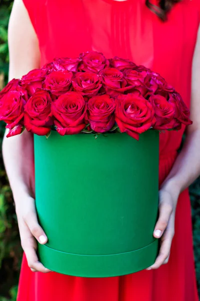 Bouquet of red roses in a box