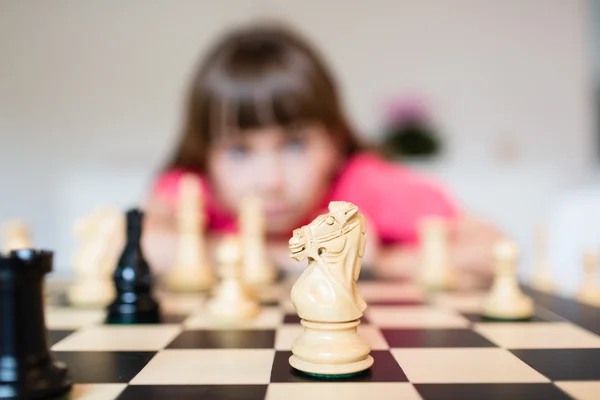 Girl and chess board