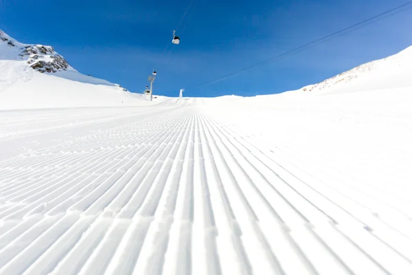 Groomed ski run at ski resort