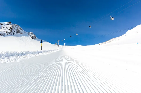 Groomed ski run at ski resort