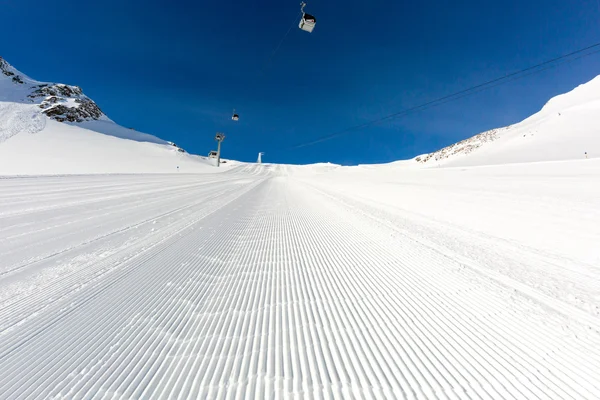 Groomed ski run at ski resort